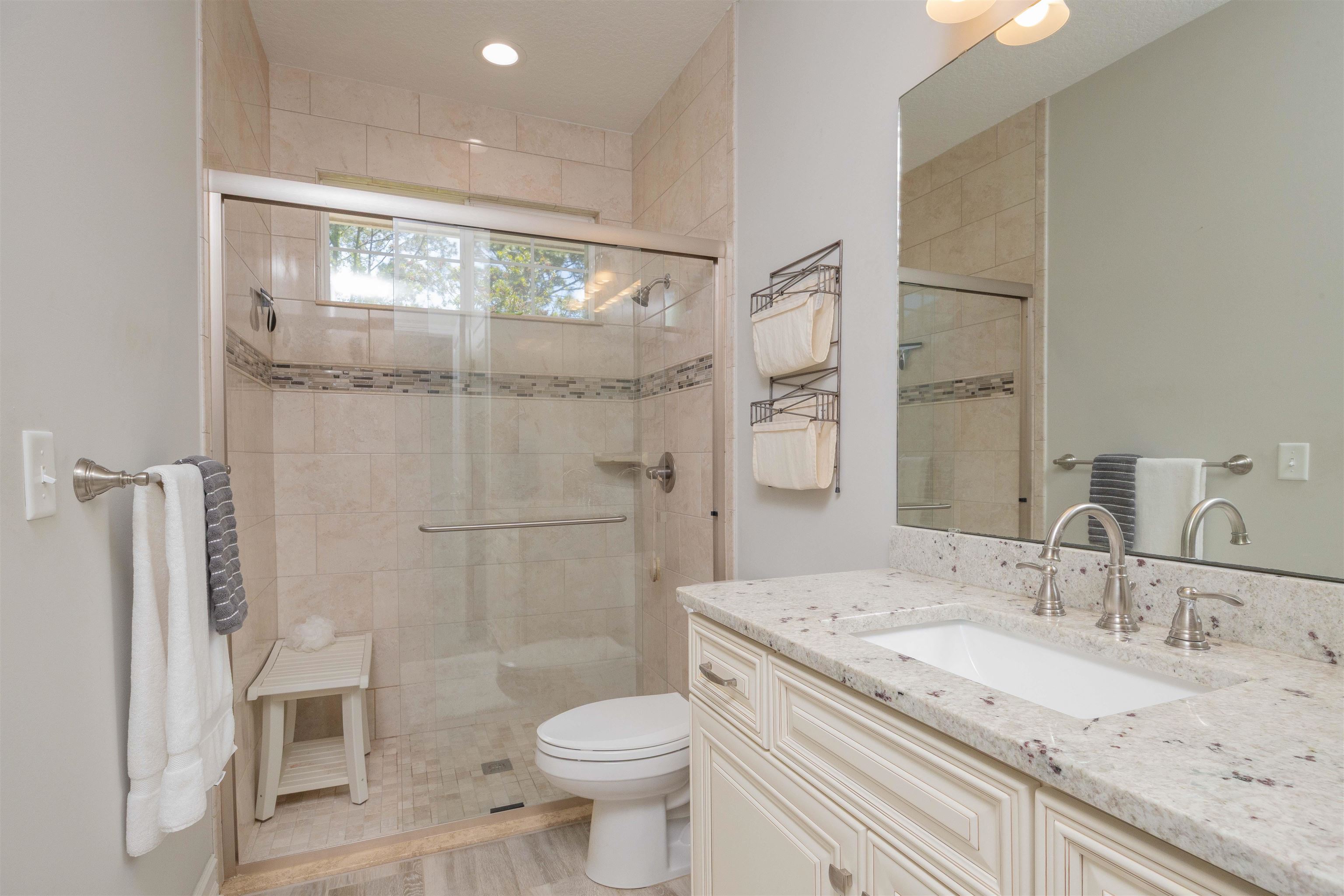 301 Graciela Circle St. Augustine, FL 32086 - Photo 54 of 84 a bathroom with a granite countertop sink toilet and shower