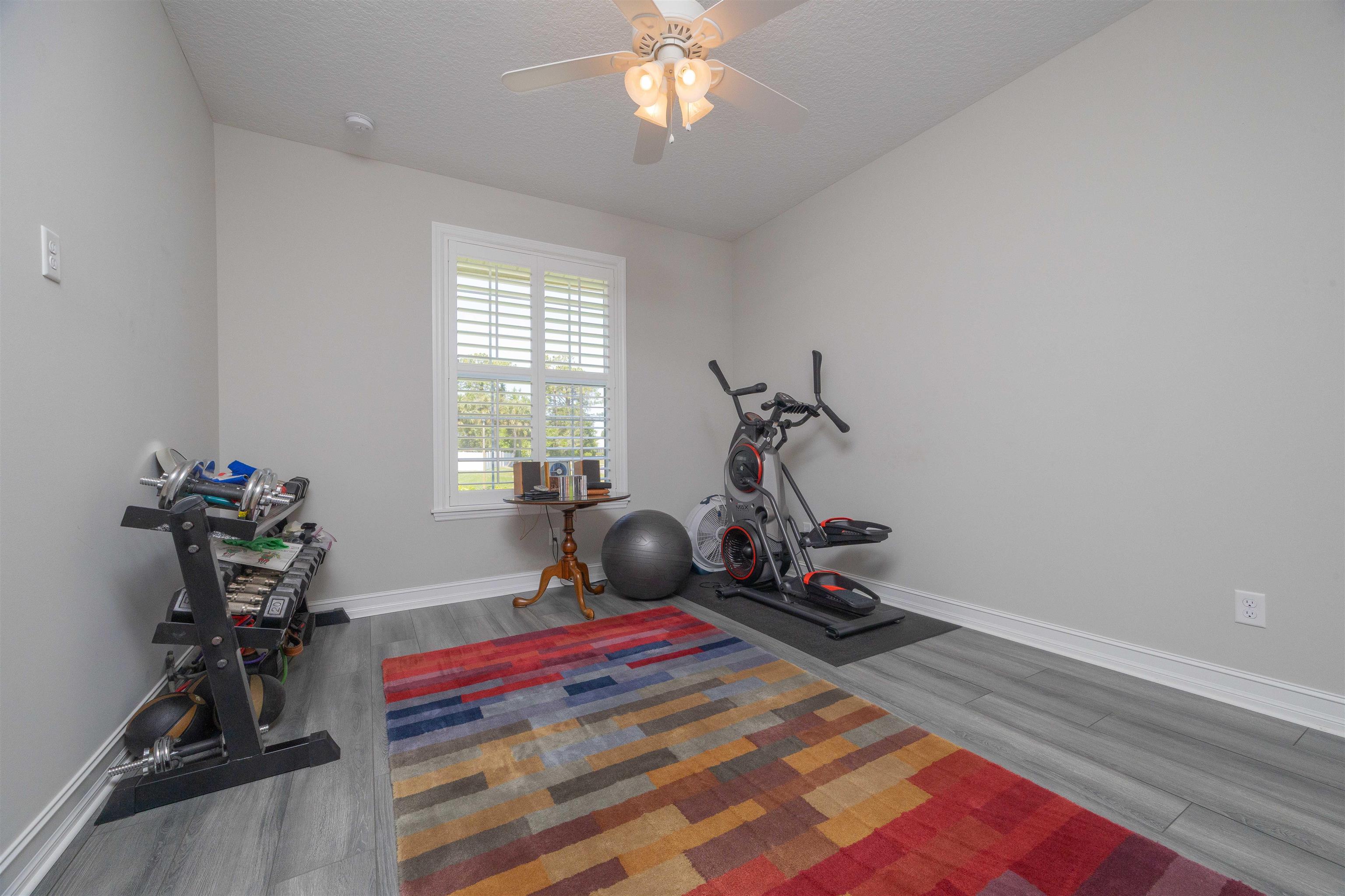 301 Graciela Circle St. Augustine, FL 32086 - Photo 55 of 84 a room with gym equipment and a large mirror