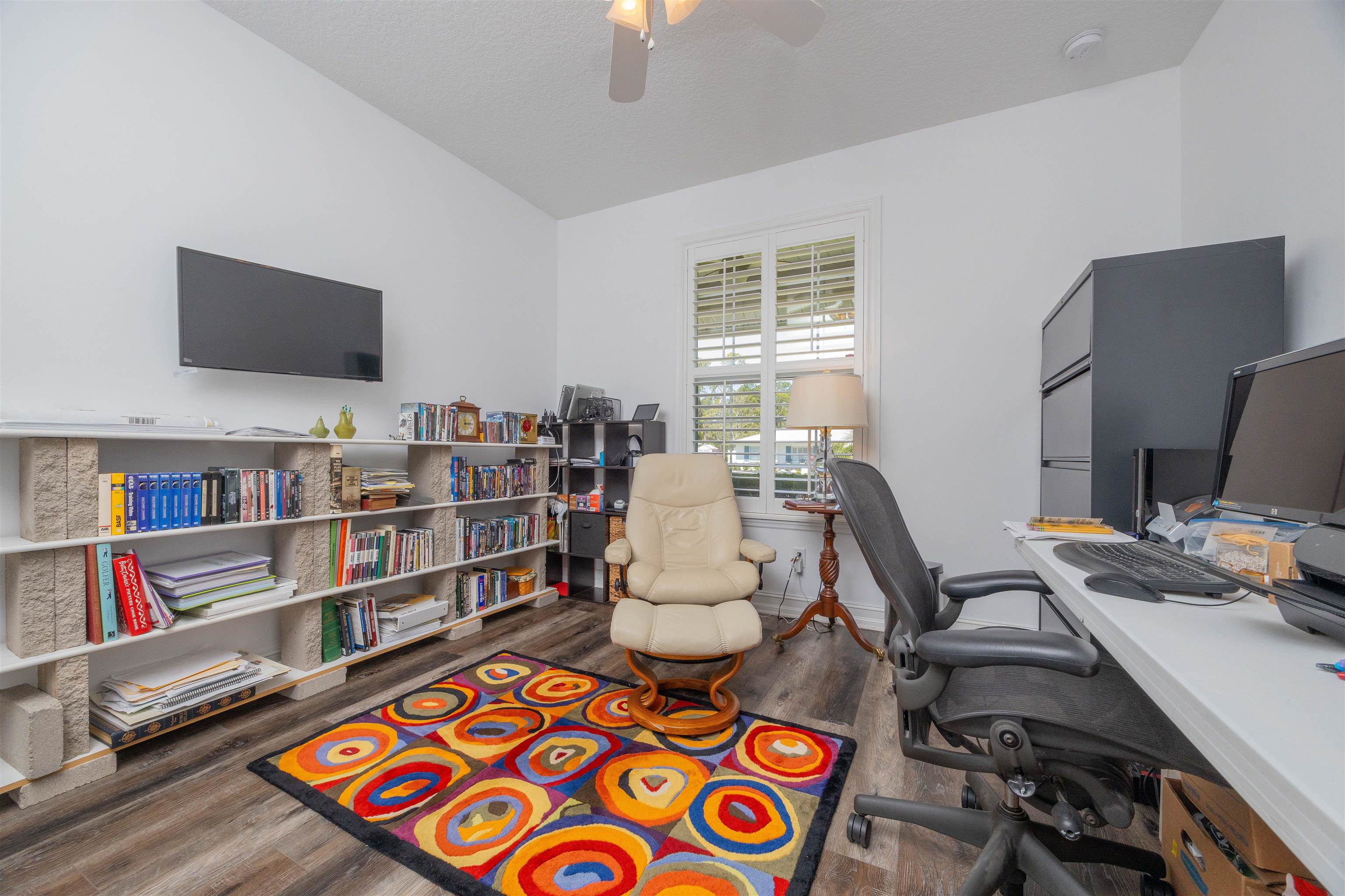 301 Graciela Circle St. Augustine, FL 32086 - Photo 58 of 84 a work room with furniture and a book shelf