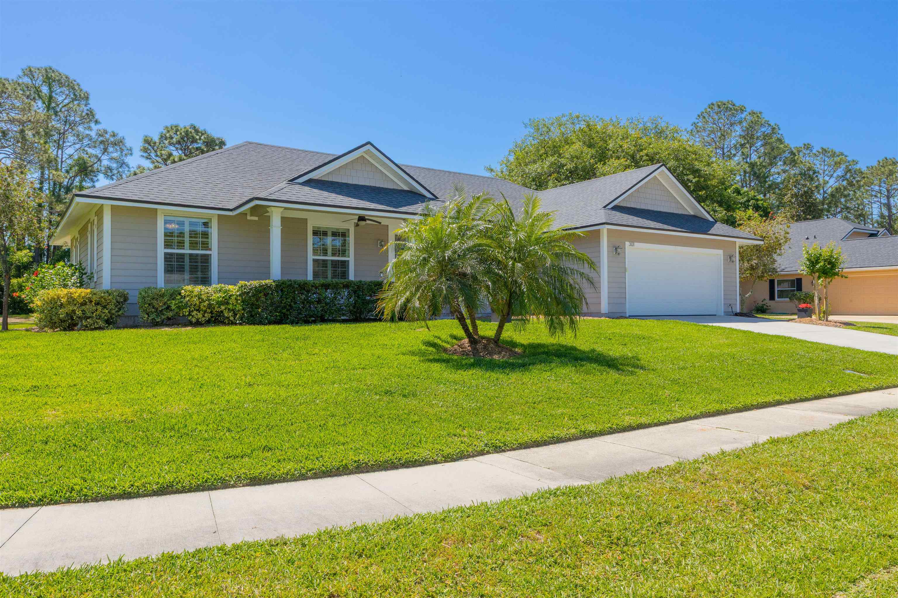 301 Graciela Circle St. Augustine, FL 32086 - Photo 8 of 84 a front view of a house with a garden and yard