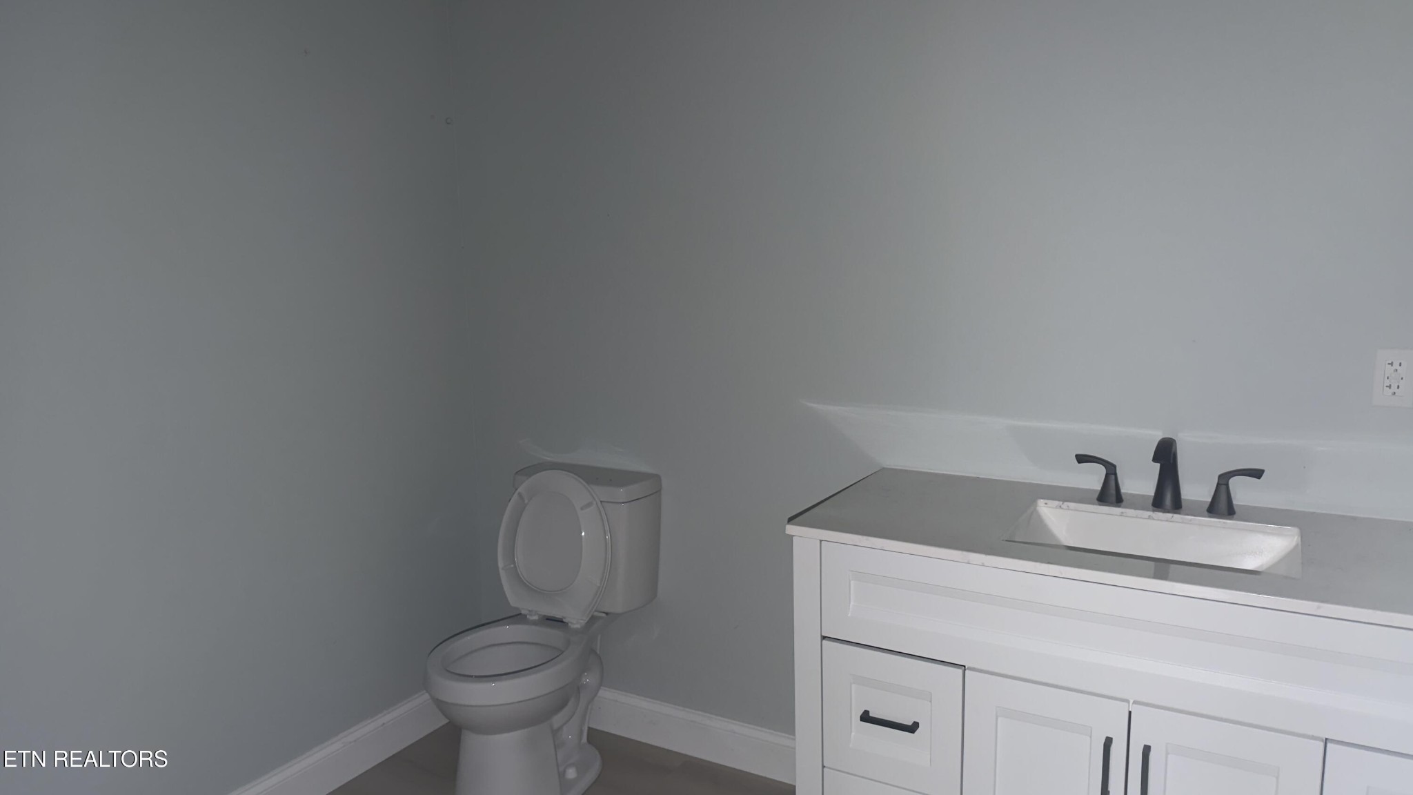 2662 Louisville Road Maryville, TN 37801 - Photo 59 of 60 a bathroom with a toilet sink and mirror