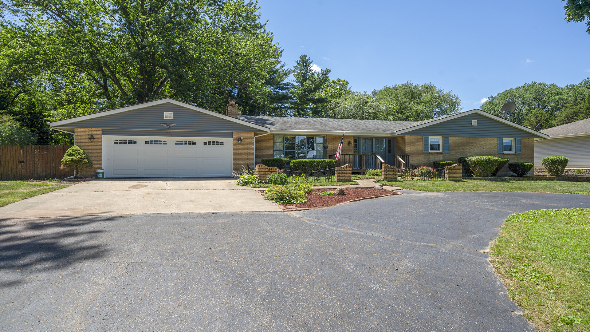 861 Riverside Drive Dixon, IL 61021 - Photo 1 of 33 a front view of a house with garden
