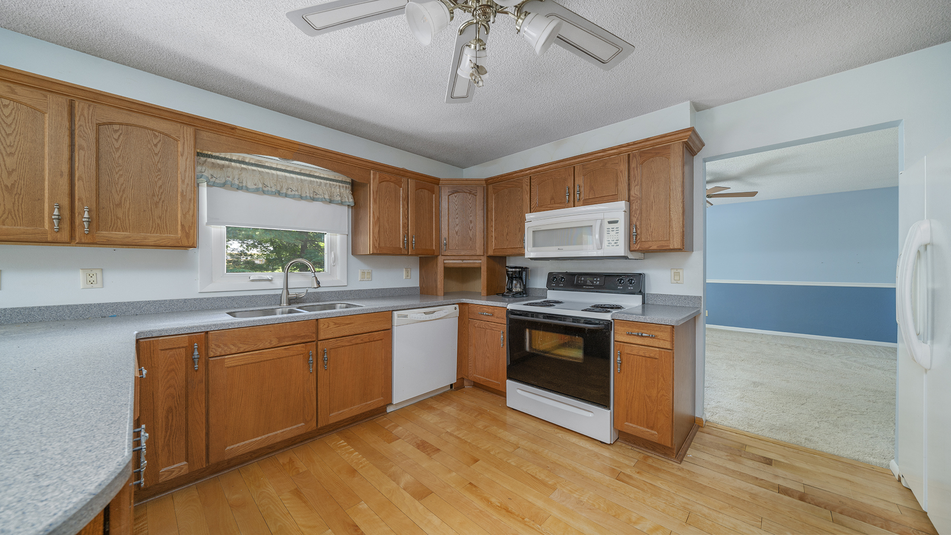 861 Riverside Drive Dixon, IL 61021 - Photo 8 of 33 a kitchen with stainless steel appliances granite countertop wooden cabinets a stove a sink and dishwasher