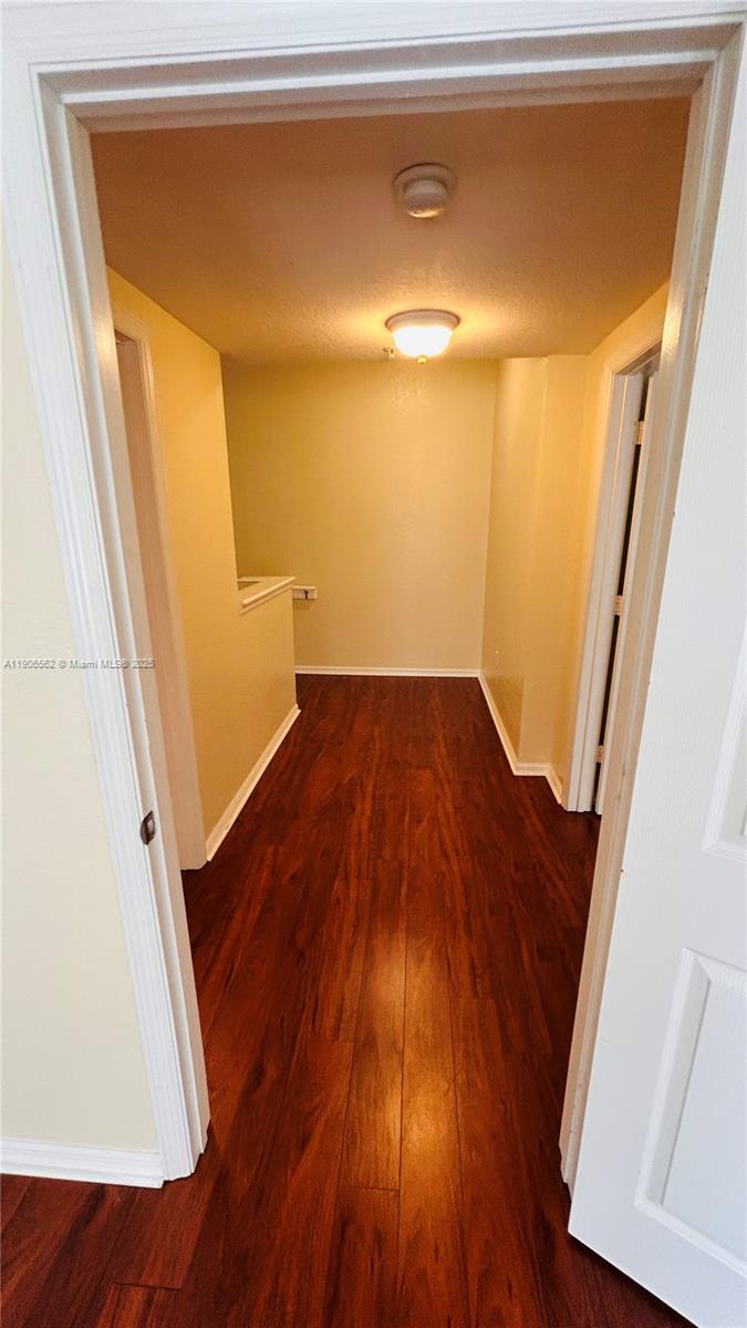 6732 West Sample Road, Unit 6732 Coral Springs, FL 33067 - Photo 13 of 25 a view of empty room with wooden floor