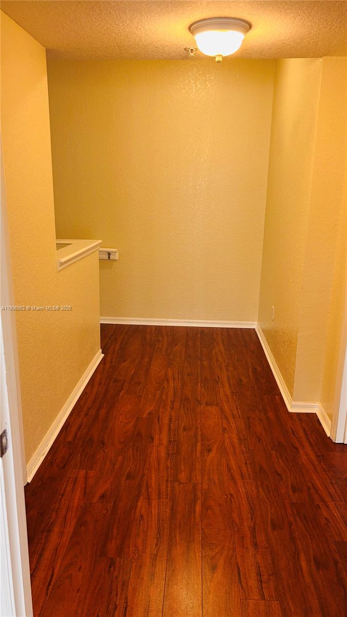 6732 West Sample Road, Unit 6732 Coral Springs, FL 33067 - Photo 18 of 25 a view of empty room with wooden floor