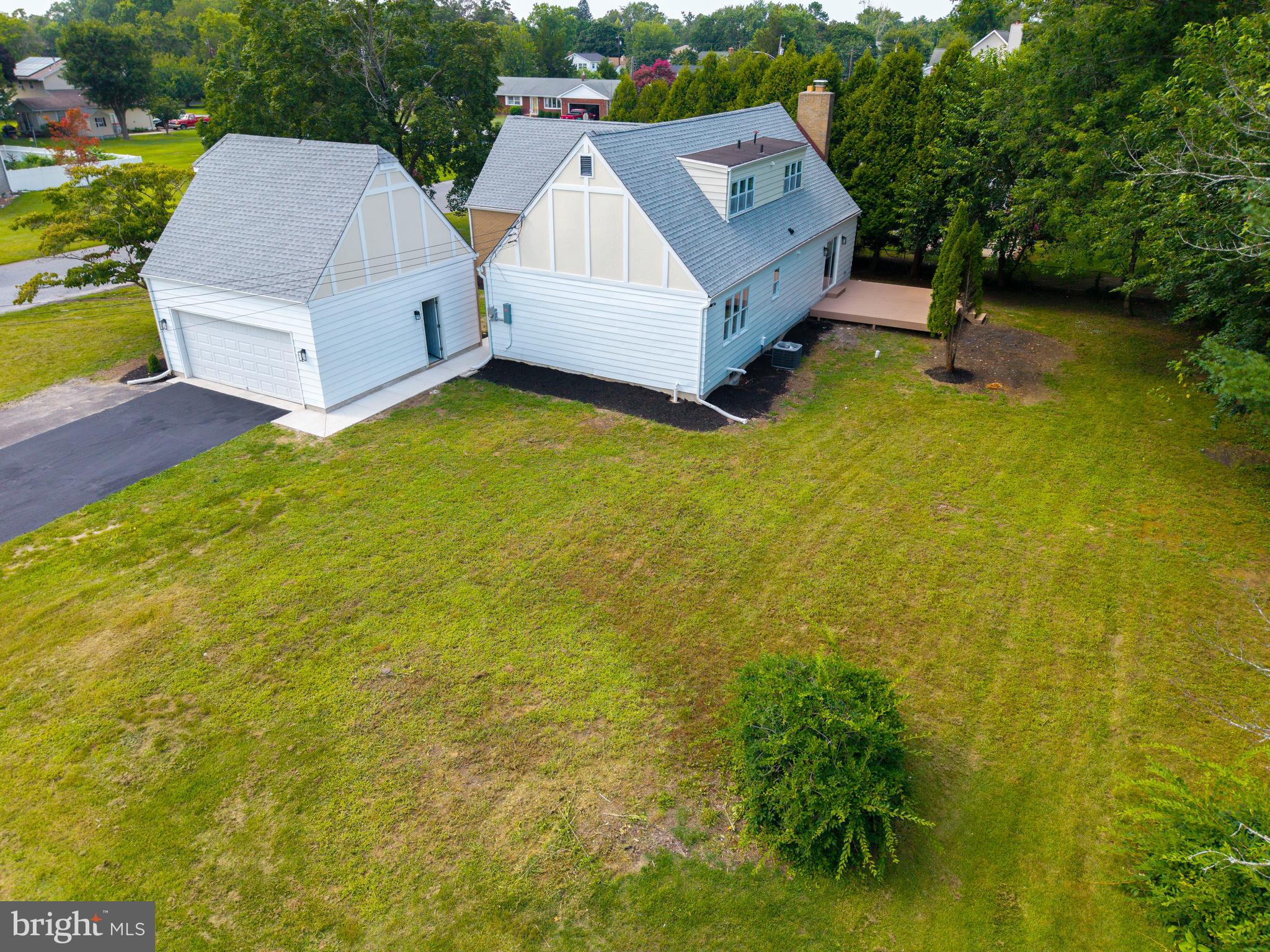 1037 Queens Road Vineland, NJ 08361 - Photo 12 of 40 a aerial view of a house with swimming pool and big yard