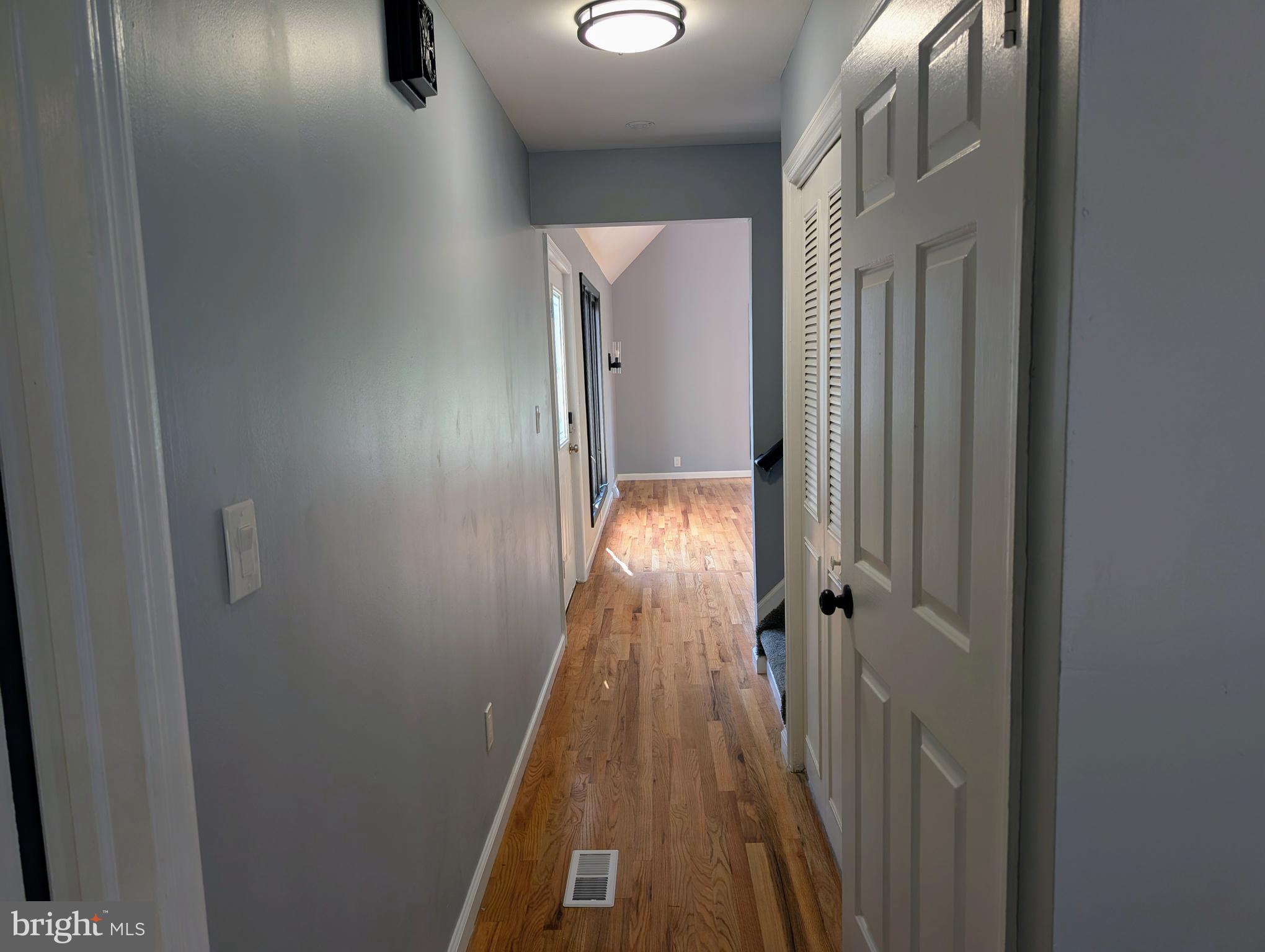 1037 Queens Road Vineland, NJ 08361 - Photo 25 of 40 a view of a hallway with wooden floor