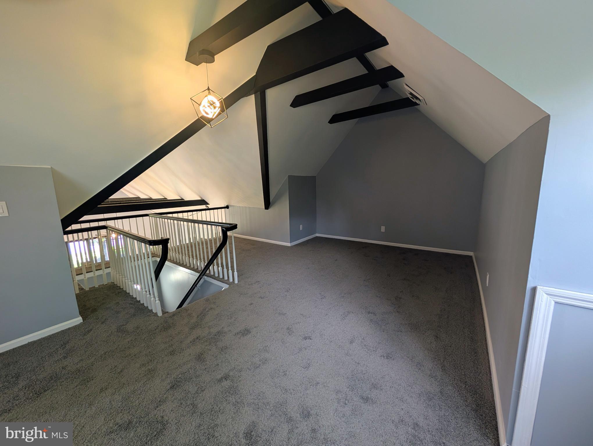 1037 Queens Road Vineland, NJ 08361 - Photo 29 of 40 an empty room with wooden floor and windows