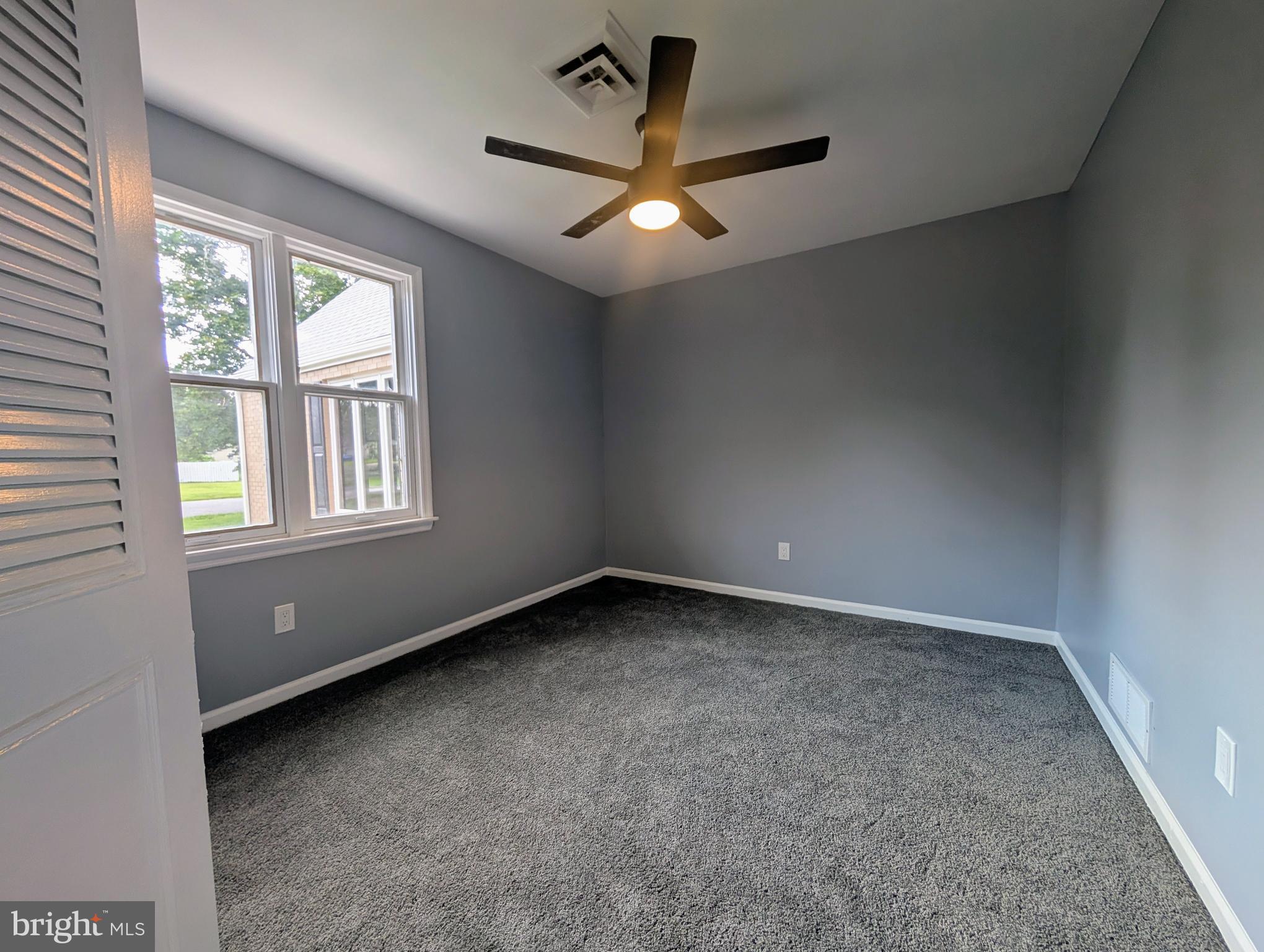 1037 Queens Road Vineland, NJ 08361 - Photo 35 of 40 an empty room with a window