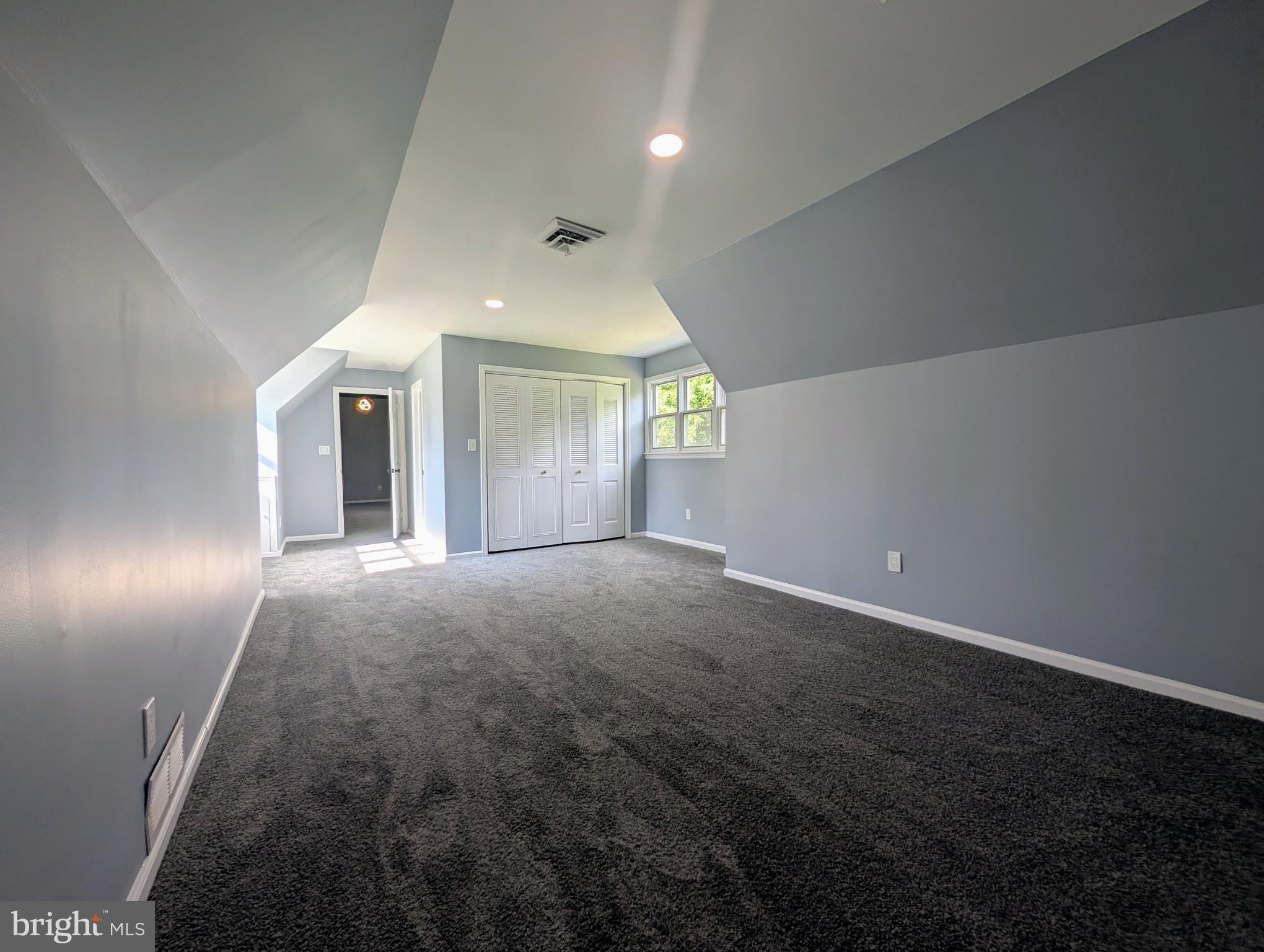1037 Queens Road Vineland, NJ 08361 - Photo 37 of 40 an empty room with windows and entrance