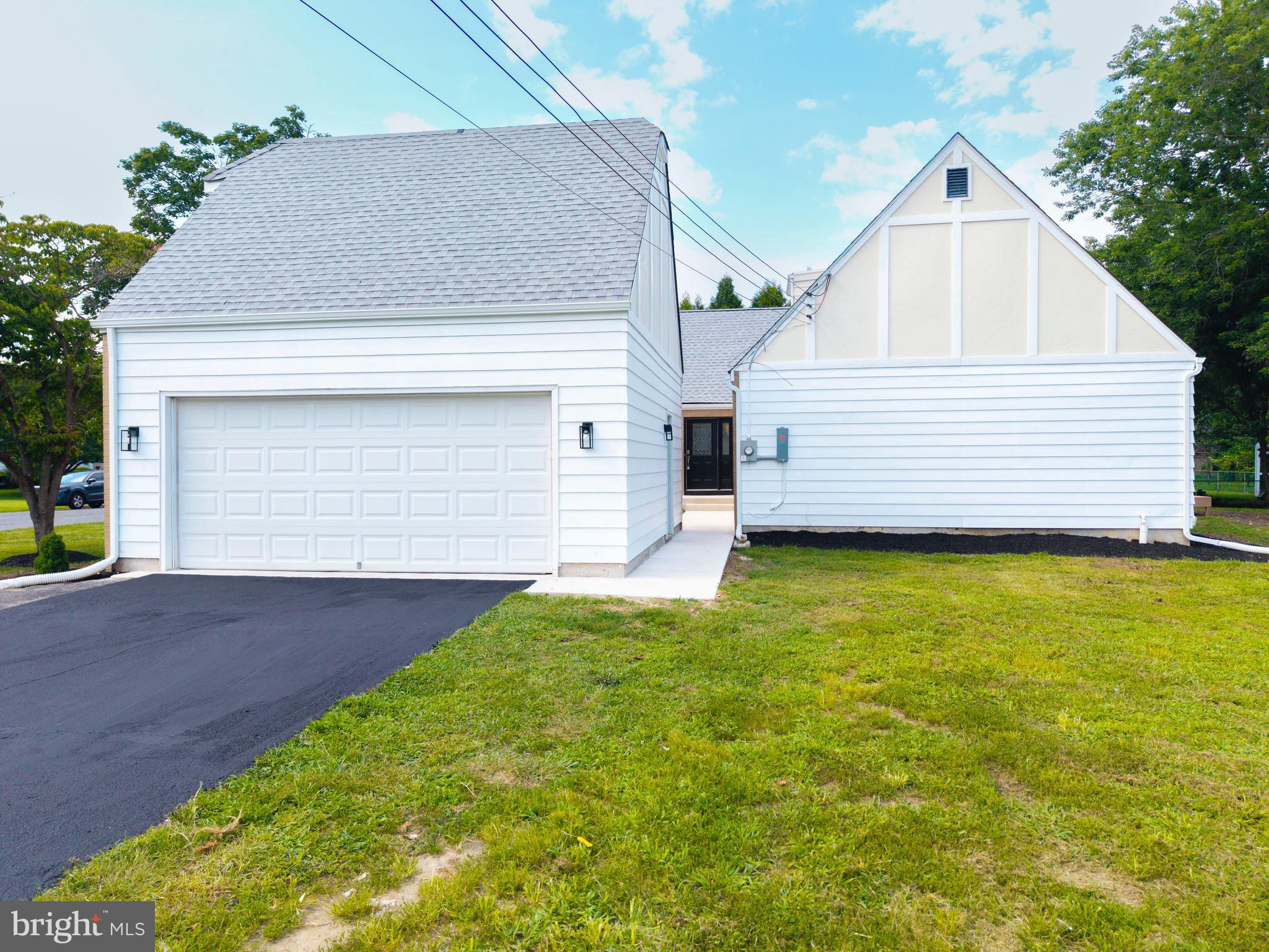 1037 Queens Road Vineland, NJ 08361 - Photo 7 of 40 a front view of a house with a yard