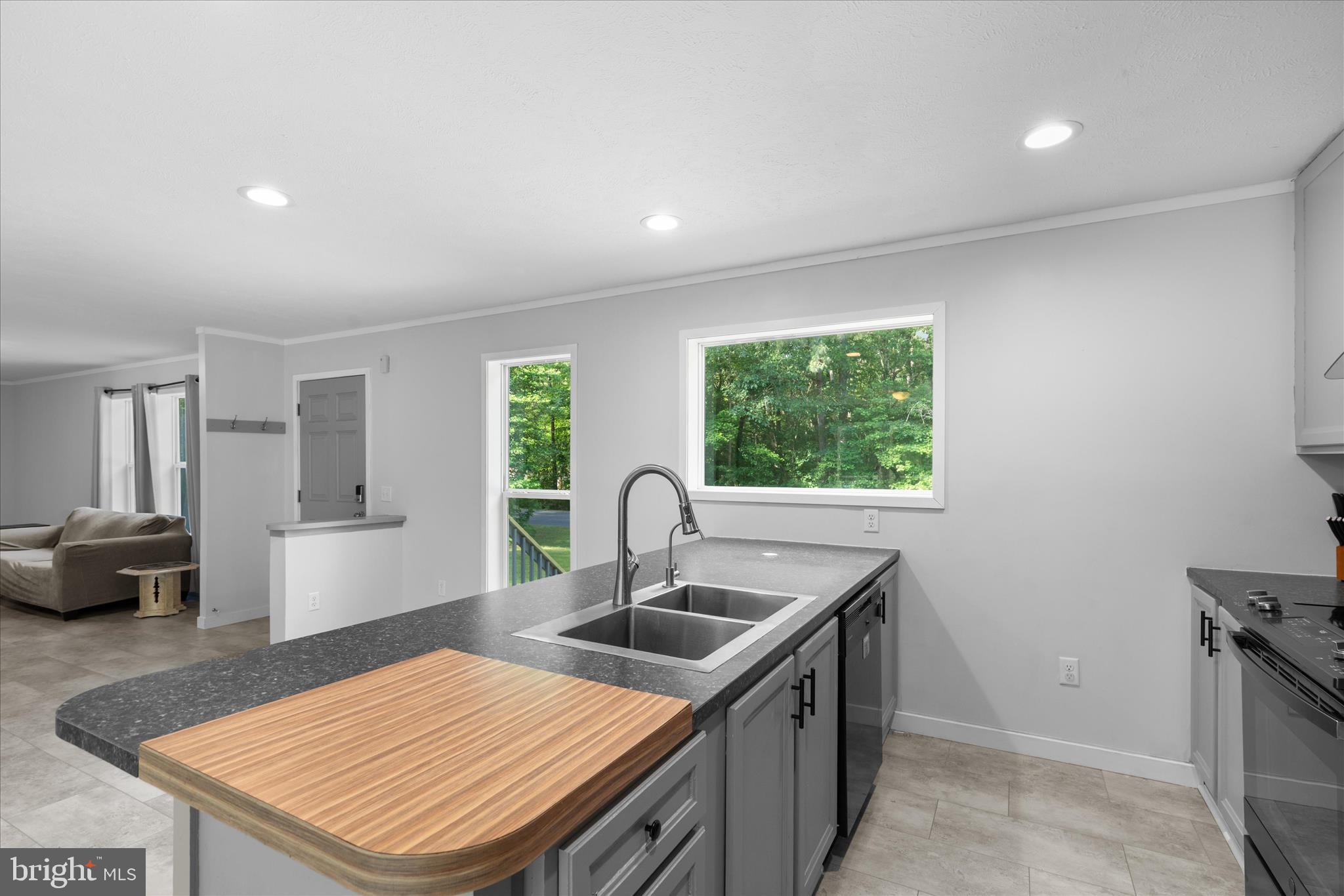 9249 Croppers Island Road Newark, MD 21841 - Photo 11 of 48 KITCHEN ISLAND BUILT-IN CUTTING BOARD