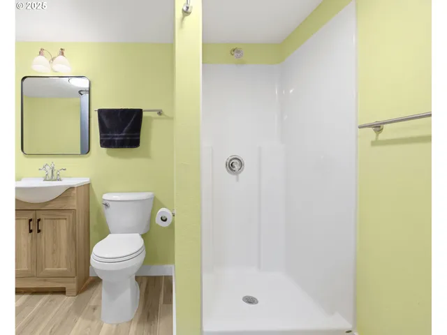 a bathroom with a toilet and a sink