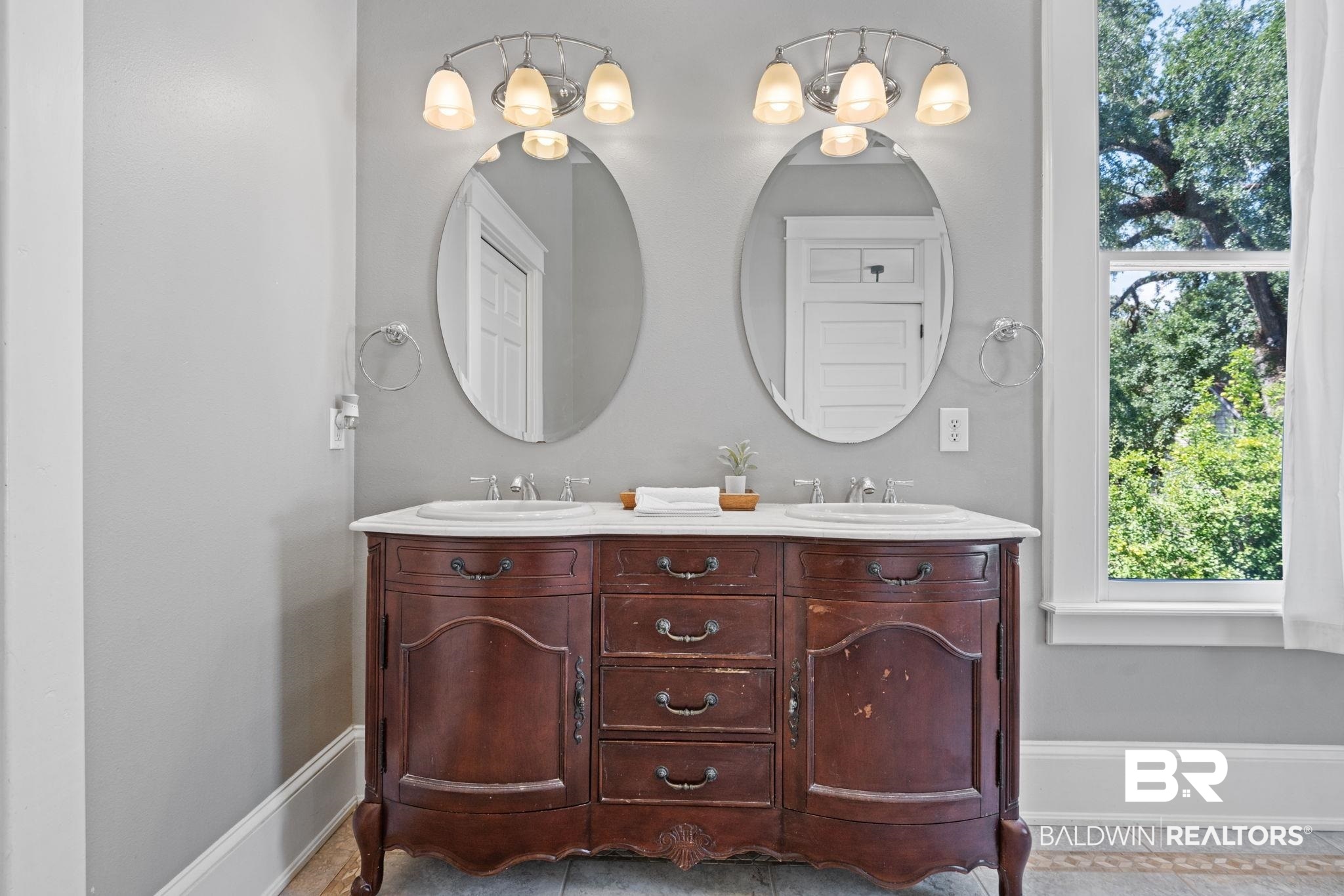 10 South Monterey Street Mobile, AL 36604 - Photo 27 of 45 Full bath featuring double vanity and light tile patterned floors