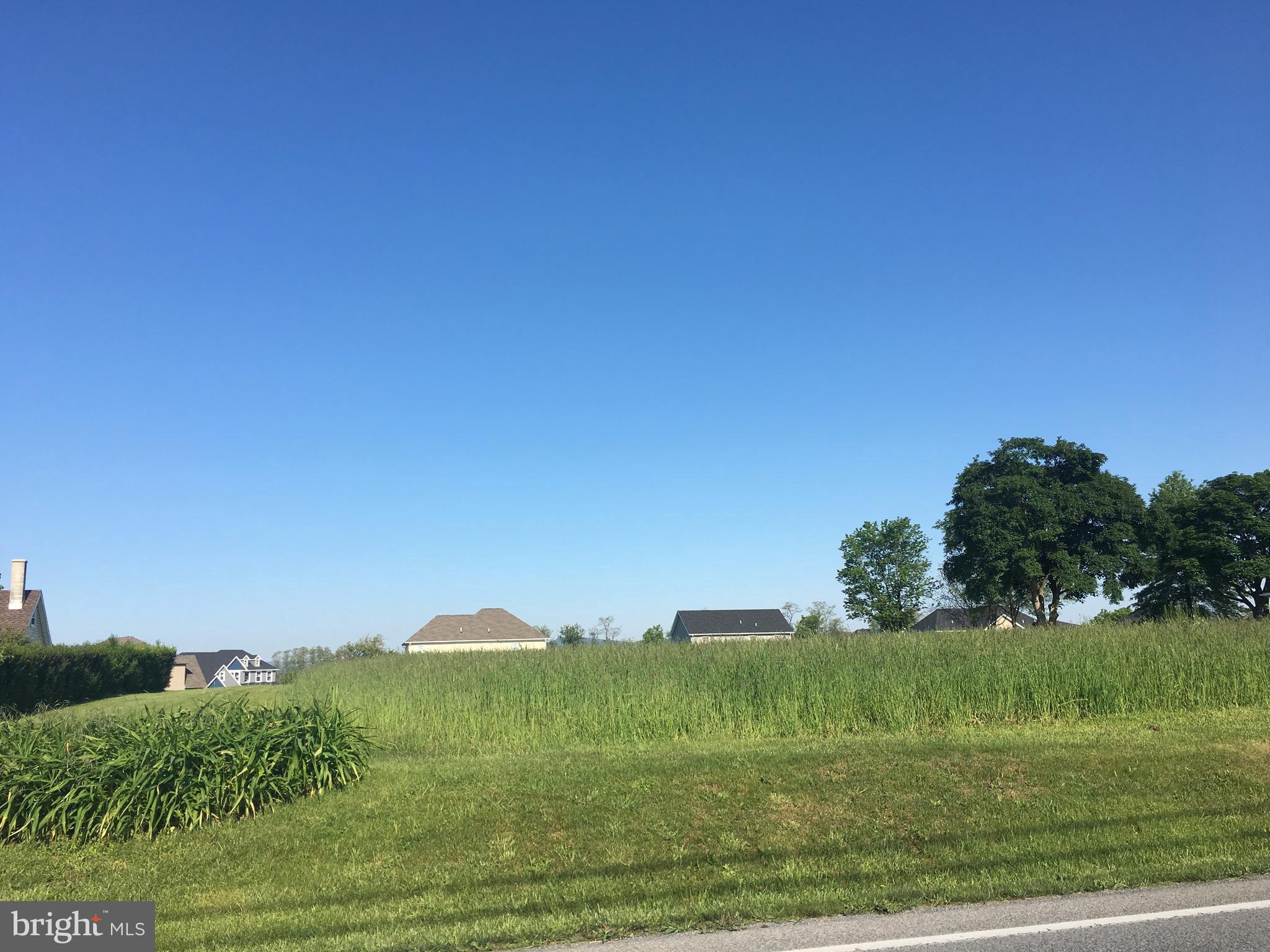 Spring Road Chambersburg, PA 17202 - Photo 1 of 6 a view of a grassy field with an trees