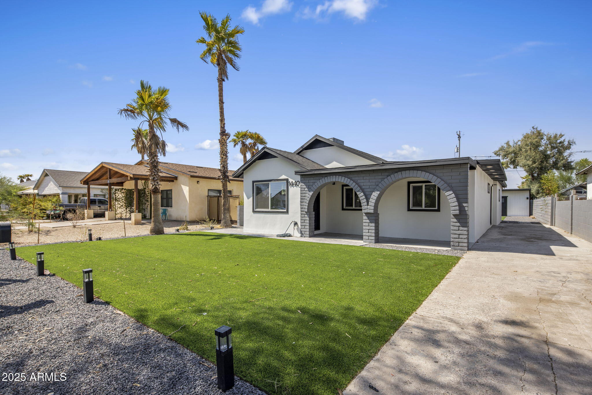 1440 East Pierce Street Phoenix, AZ 85006 - Photo 2 of 20 a front view of a house with garden