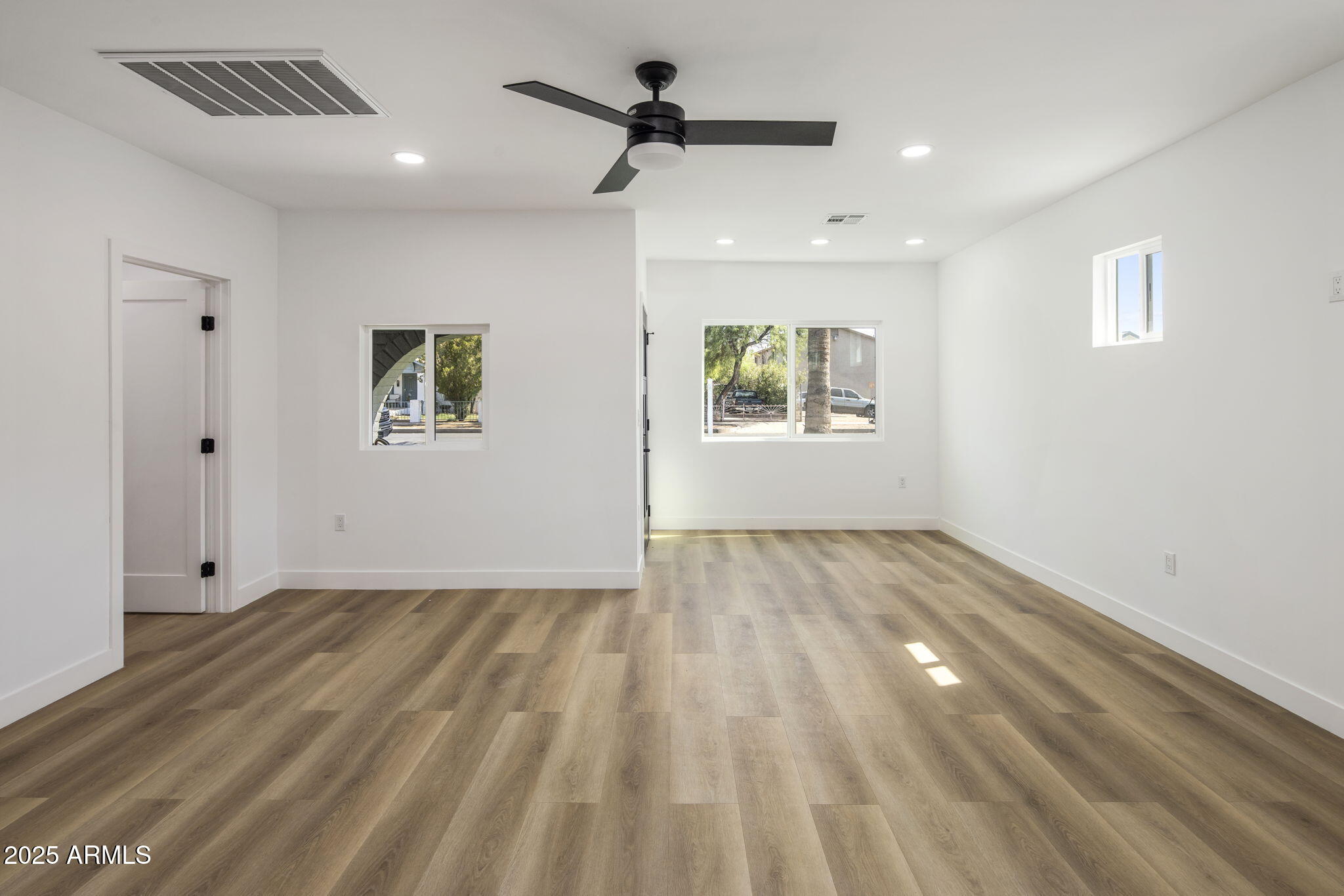 1440 East Pierce Street Phoenix, AZ 85006 - Photo 5 of 20 a view of empty room with wooden floor