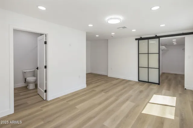 a view of entryway with wooden floor