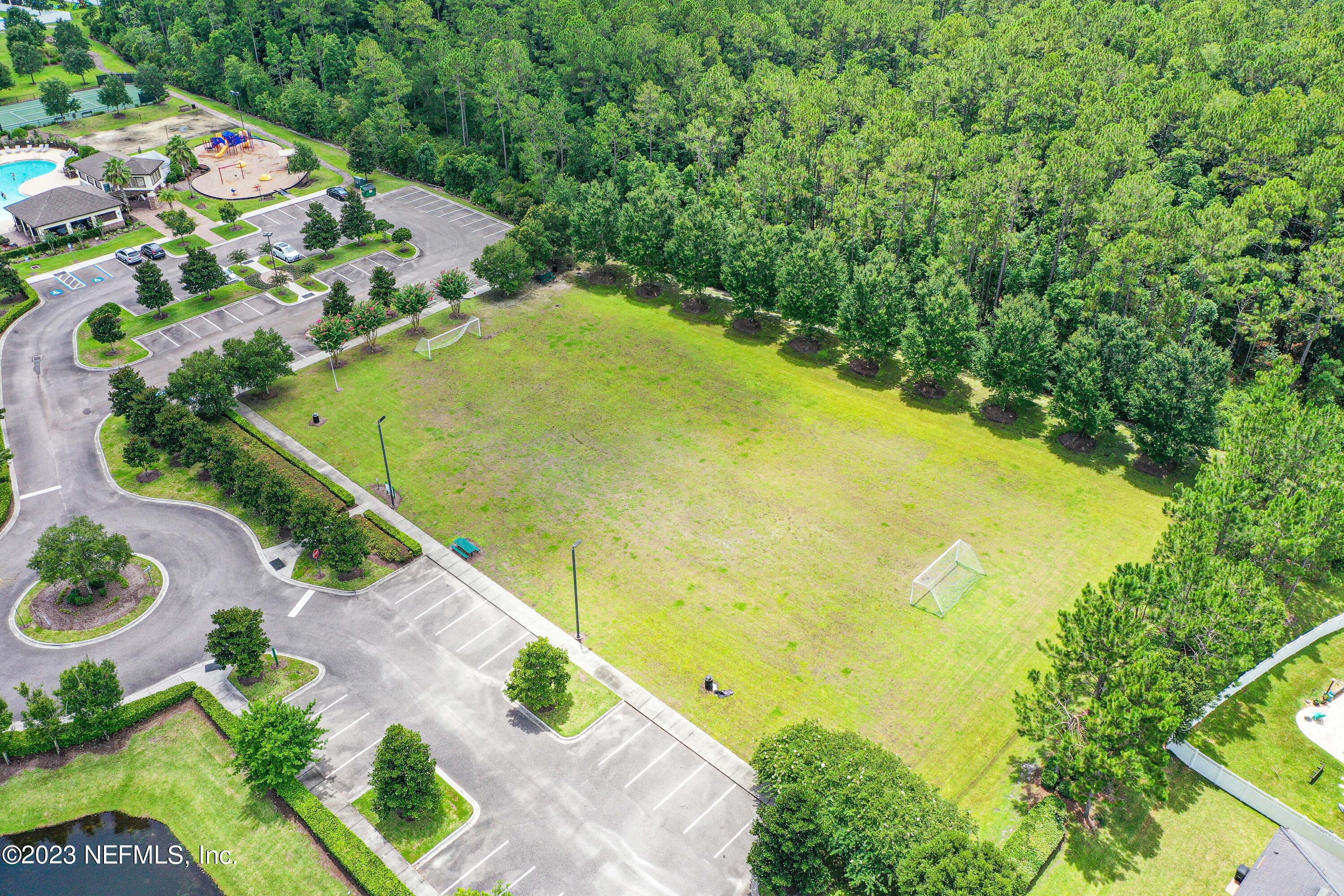 418 Hepburn Road Orange Park, FL 32065 - Photo 54 of 54 a view of a swimming pool with a yard