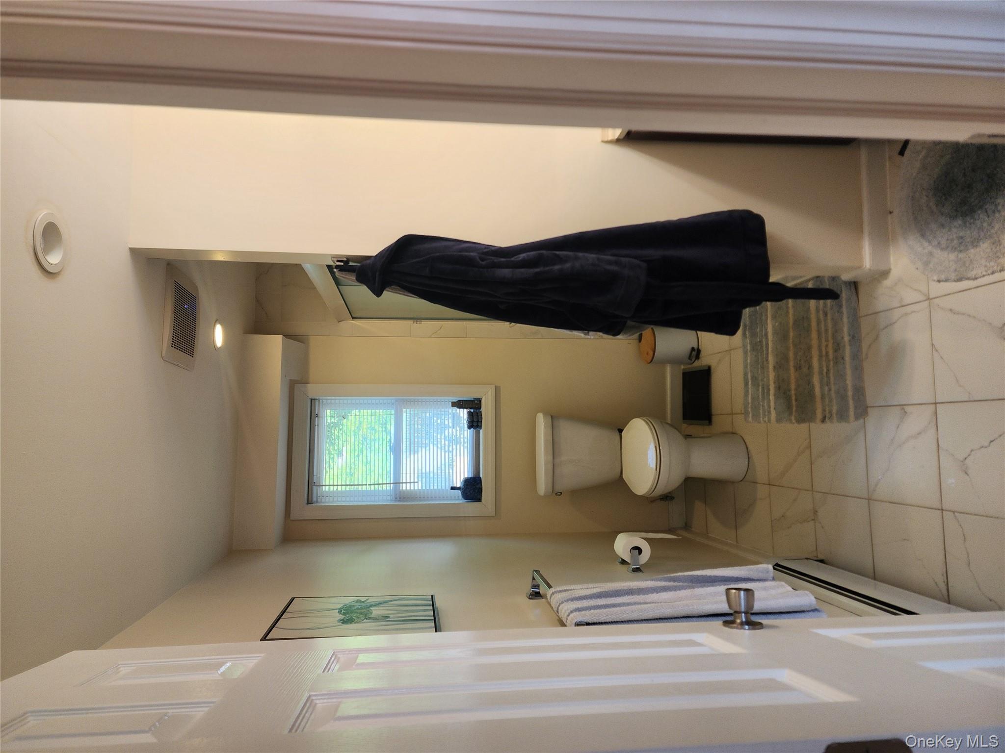 632 Piermont Avenue, Unit 2 Piermont, NY 10968 - Photo 13 of 31 a bathroom with a toilet a sink and mirror