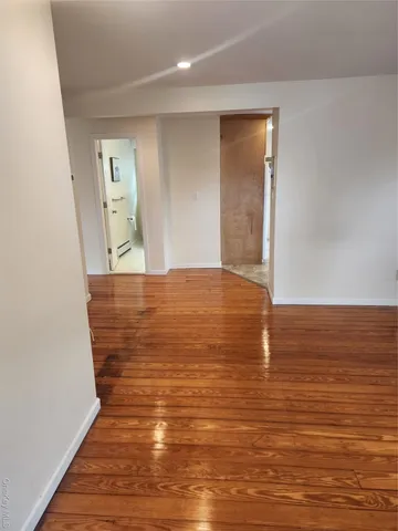 a view of room and wooden floor