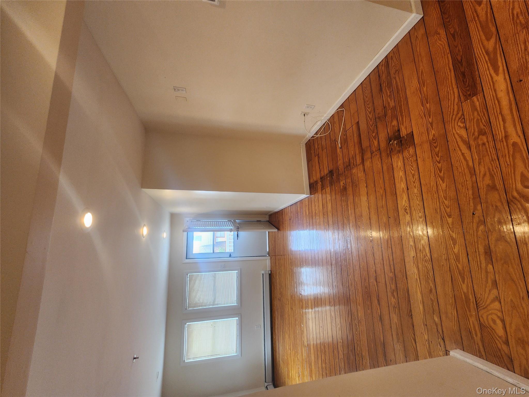 632 Piermont Avenue, Unit 2 Piermont, NY 10968 - Photo 25 of 31 a view of empty room with wooden floor and window