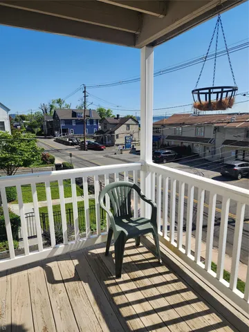 a view of a balcony with chairs