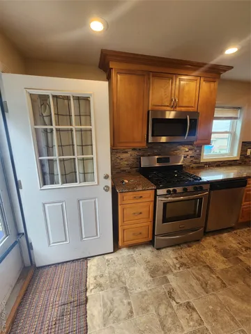 a kitchen with a stove and a microwave