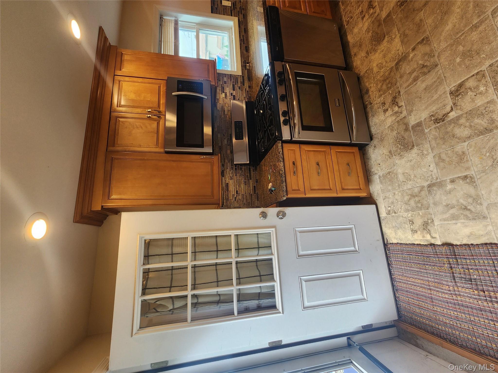 632 Piermont Avenue, Unit 2 Piermont, NY 10968 - Photo 4 of 31 a kitchen with a stove and a microwave