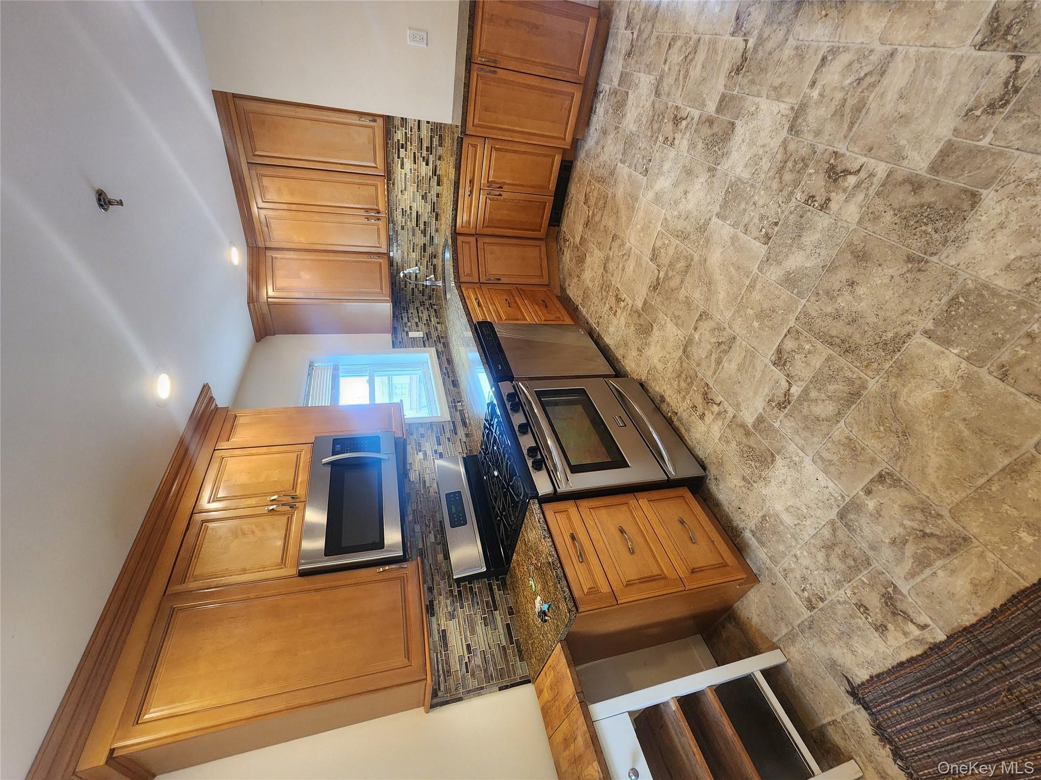 632 Piermont Avenue, Unit 2 Piermont, NY 10968 - Photo 6 of 31 a kitchen with stainless steel appliances granite countertop a stove a sink and a refrigerator
