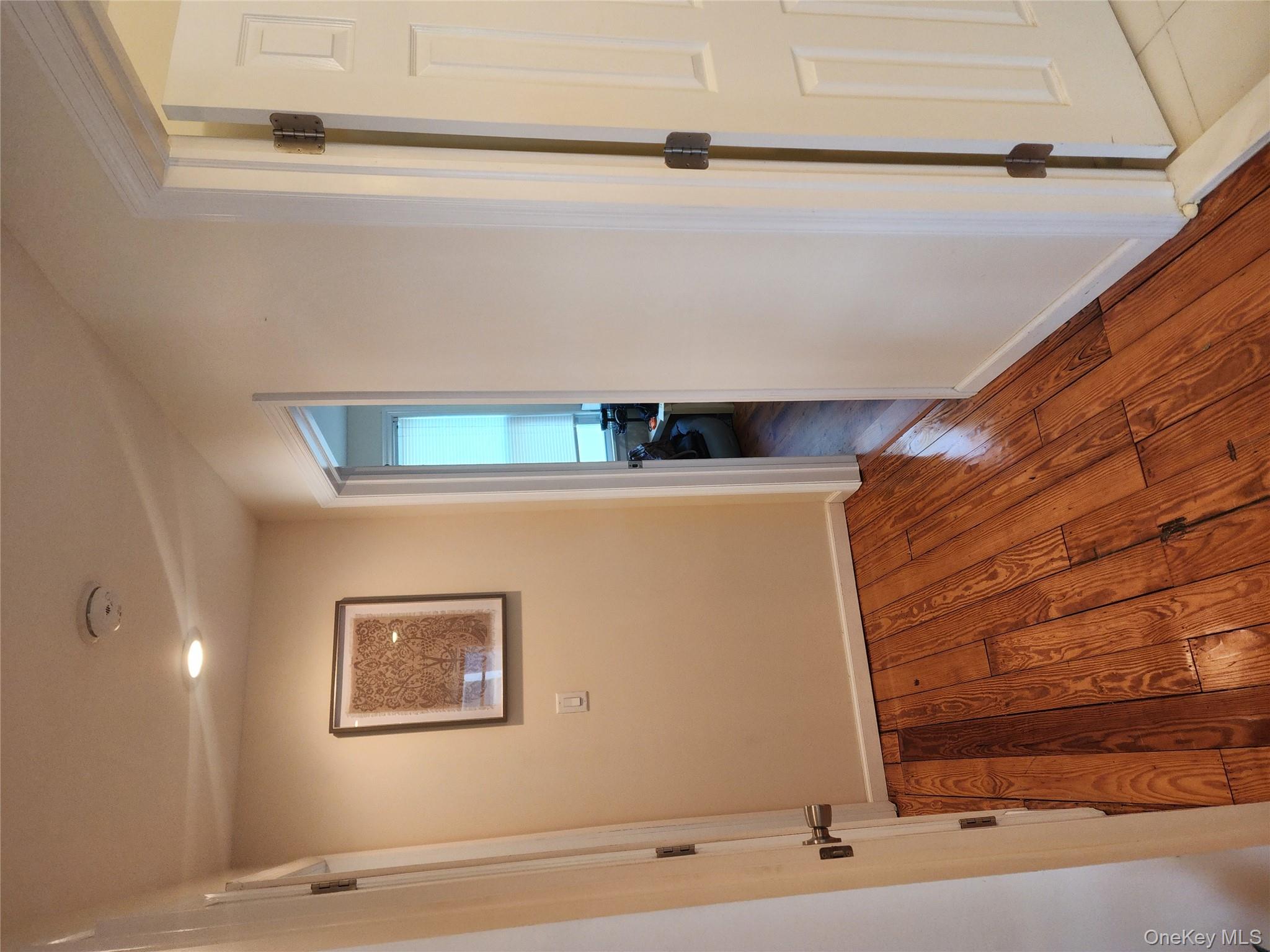 632 Piermont Avenue, Unit 2 Piermont, NY 10968 - Photo 10 of 31 wooden floor in an empty room with a window
