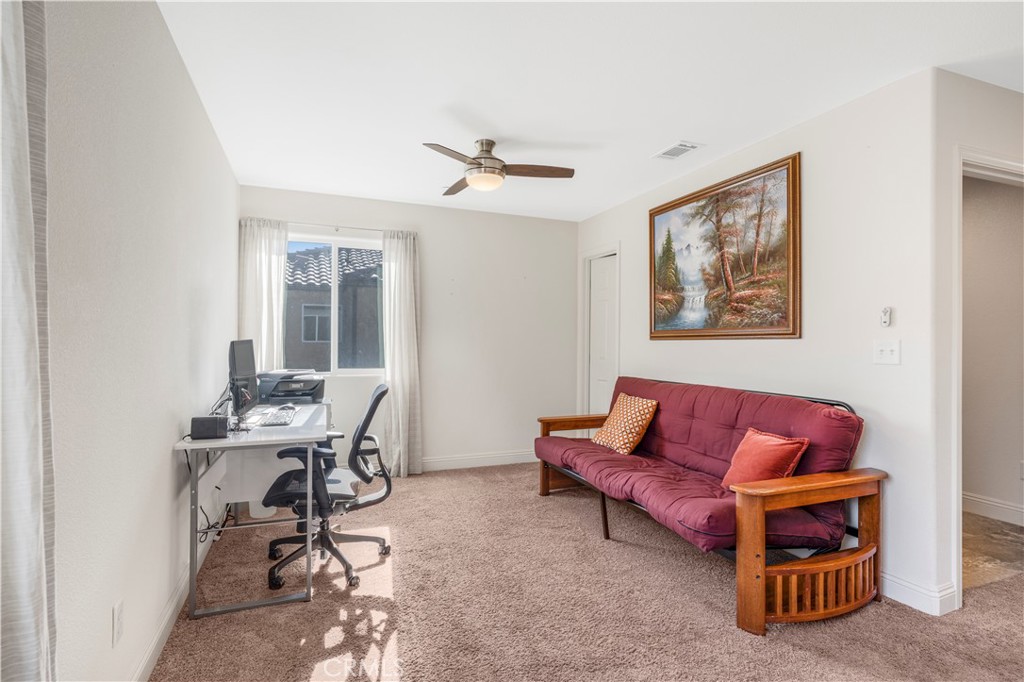 4368 Ladera Drive Guadalupe, CA 93434 - Photo 13 of 39 a living room with furniture a table and a potted plant