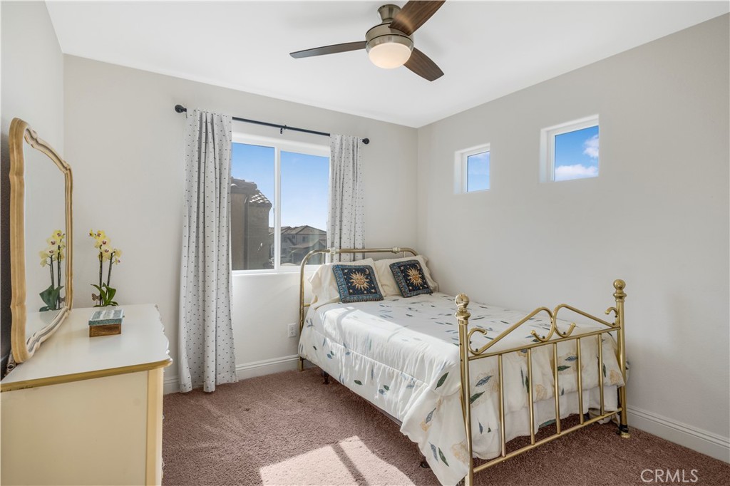 4368 Ladera Drive Guadalupe, CA 93434 - Photo 15 of 39 a bedroom with a bed a mirror and the dresser