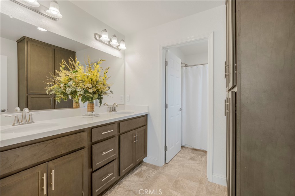 4368 Ladera Drive Guadalupe, CA 93434 - Photo 17 of 39 a spacious bathroom with a granite countertop sink a mirror and a shower