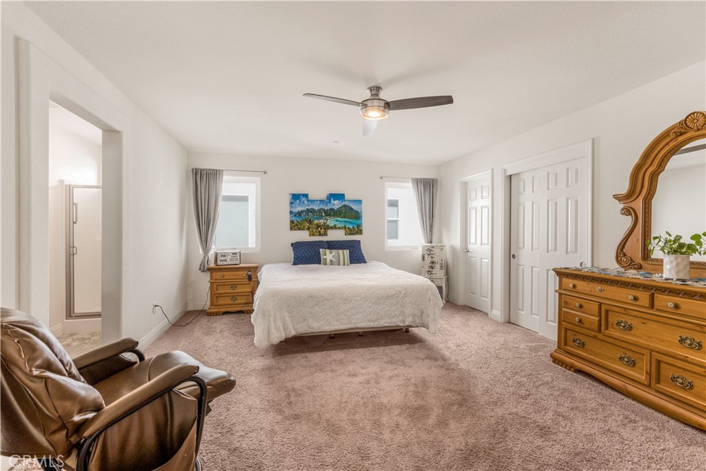 4368 Ladera Drive Guadalupe, CA 93434 - Photo 19 of 39 a bedroom with a bed and wooden floor