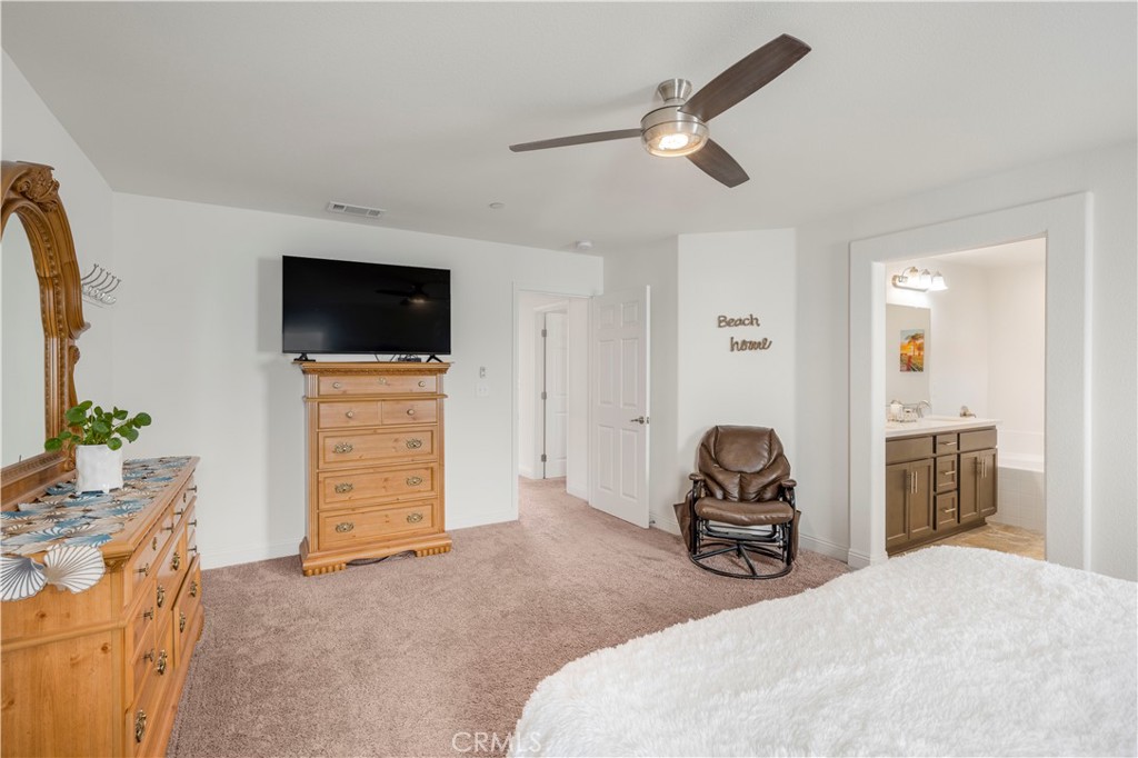 4368 Ladera Drive Guadalupe, CA 93434 - Photo 20 of 39 a bedroom with furniture and a flat screen tv
