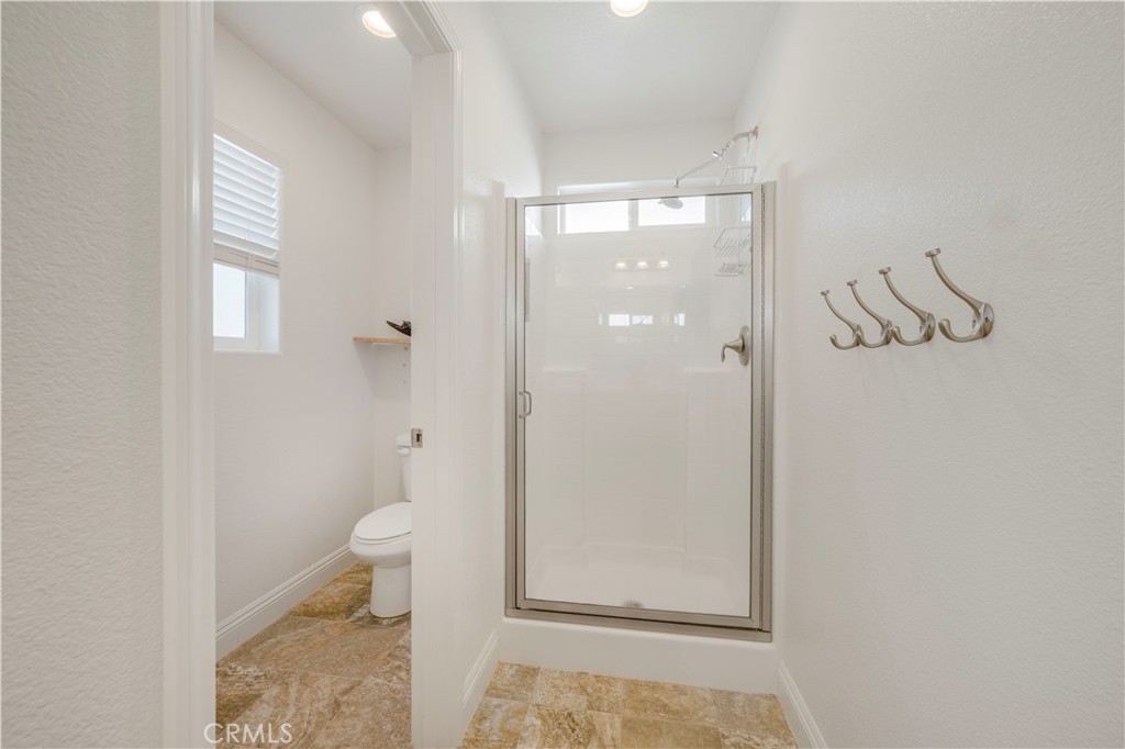 4368 Ladera Drive Guadalupe, CA 93434 - Photo 22 of 39 a bathroom with a granite countertop shower a toilet and a sink