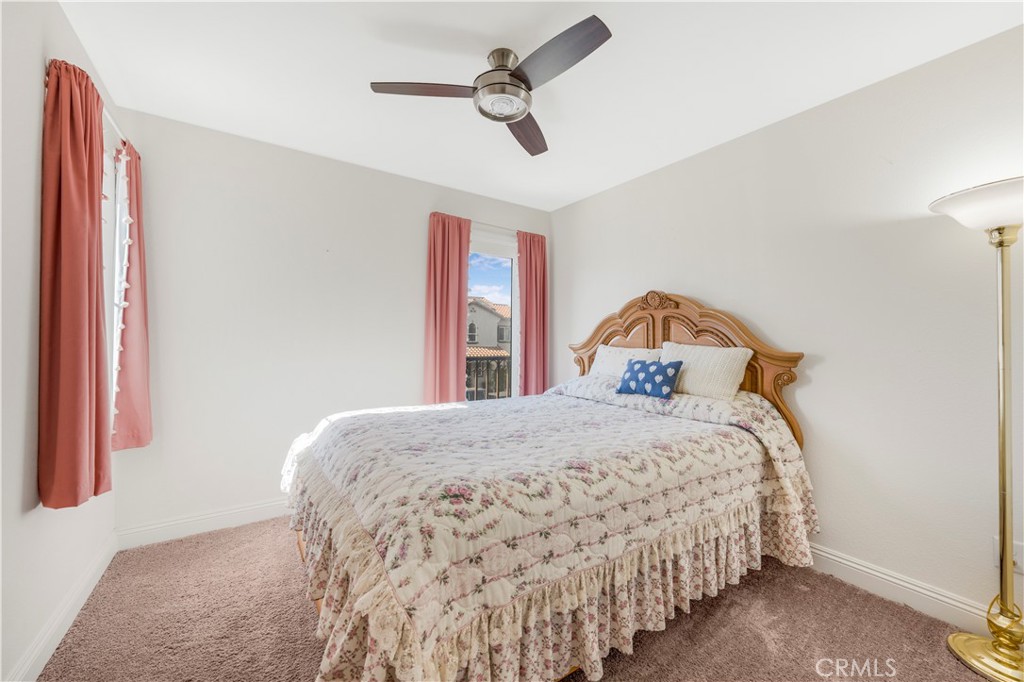 4368 Ladera Drive Guadalupe, CA 93434 - Photo 24 of 39 a bedroom with a bed and a chandelier