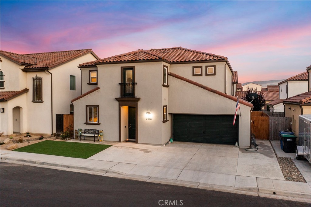 4368 Ladera Drive Guadalupe, CA 93434 - Photo 3 of 39 a front view of a house with a yard and garage