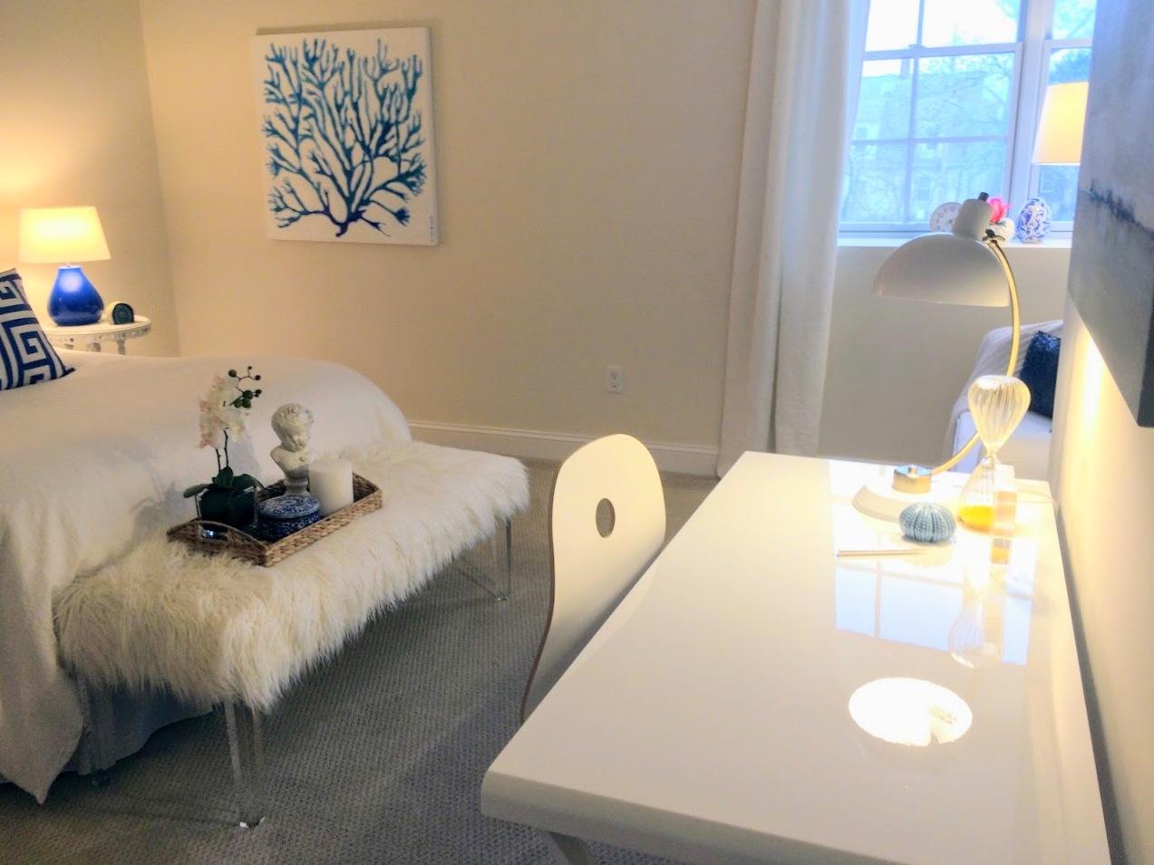 89 Lewis Bay Road, Unit 201 Hyannis, MA 02601 - Photo 9 of 17 a bedroom with a bed and a table