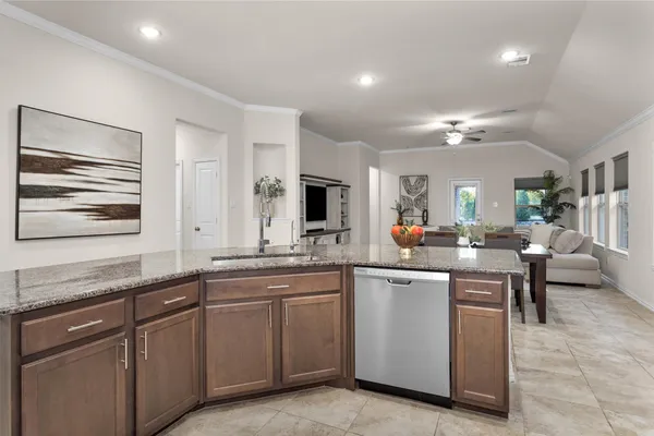 a kitchen with sink and cabinets