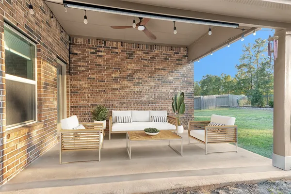 a backyard of a house with table and chairs