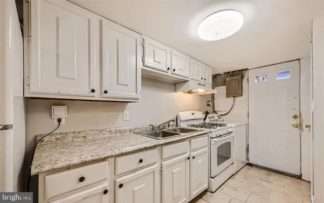 a bathroom with a sink mirror and vanity