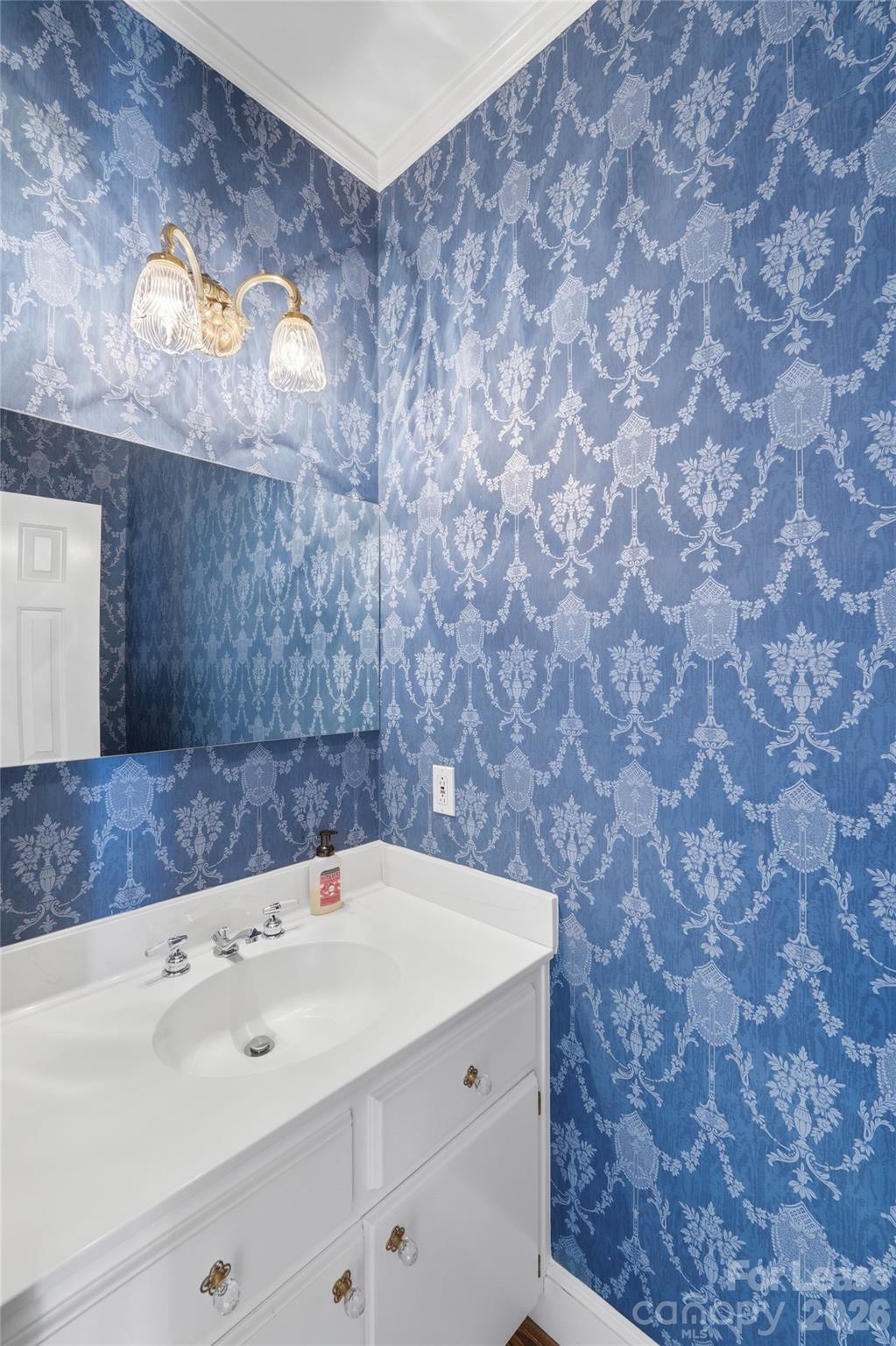 5906 Sharon Hills Road Charlotte, NC 28210 - Photo 23 of 30 a bathroom with a sink and a mirror