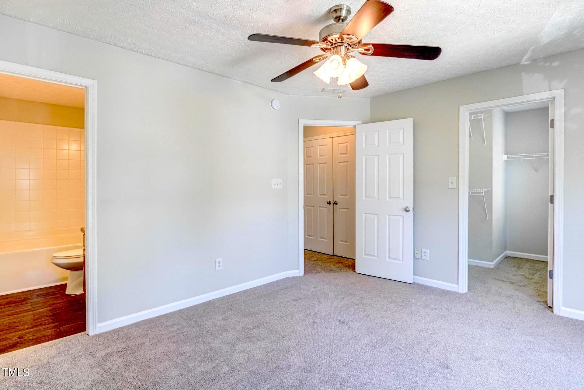 4 Intrepid Court Durham, NC 27703 - Photo 12 of 25 a view of an empty room and chandelier fan