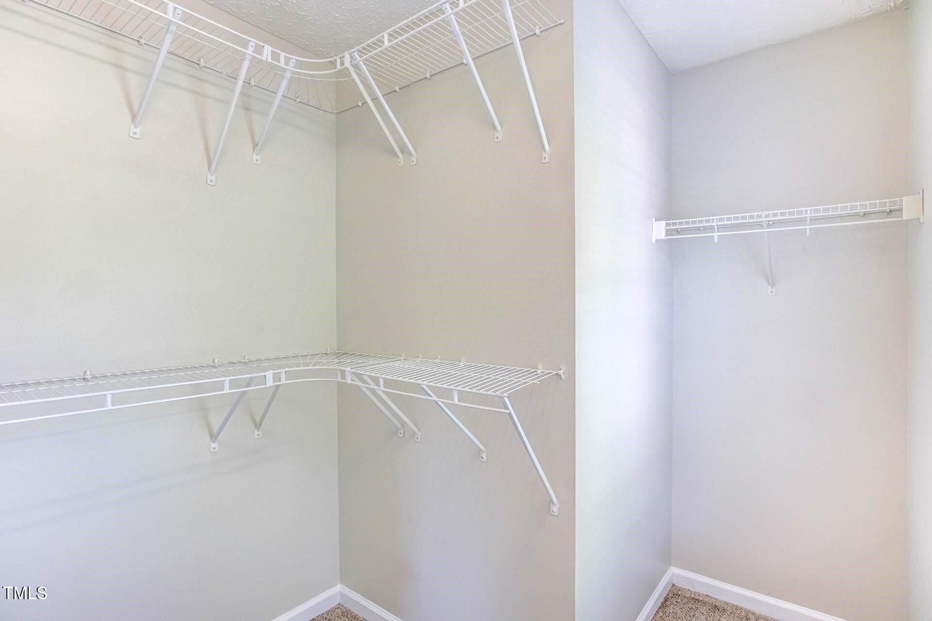 4 Intrepid Court Durham, NC 27703 - Photo 13 of 25 a view of an empty walk in closet