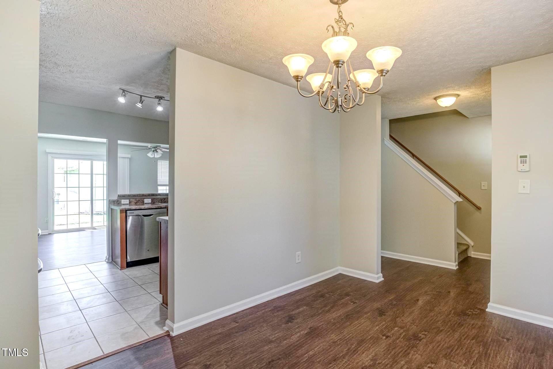 4 Intrepid Court Durham, NC 27703 - Photo 4 of 25 a view of a kitchen with a dishwasher cabinets and a window