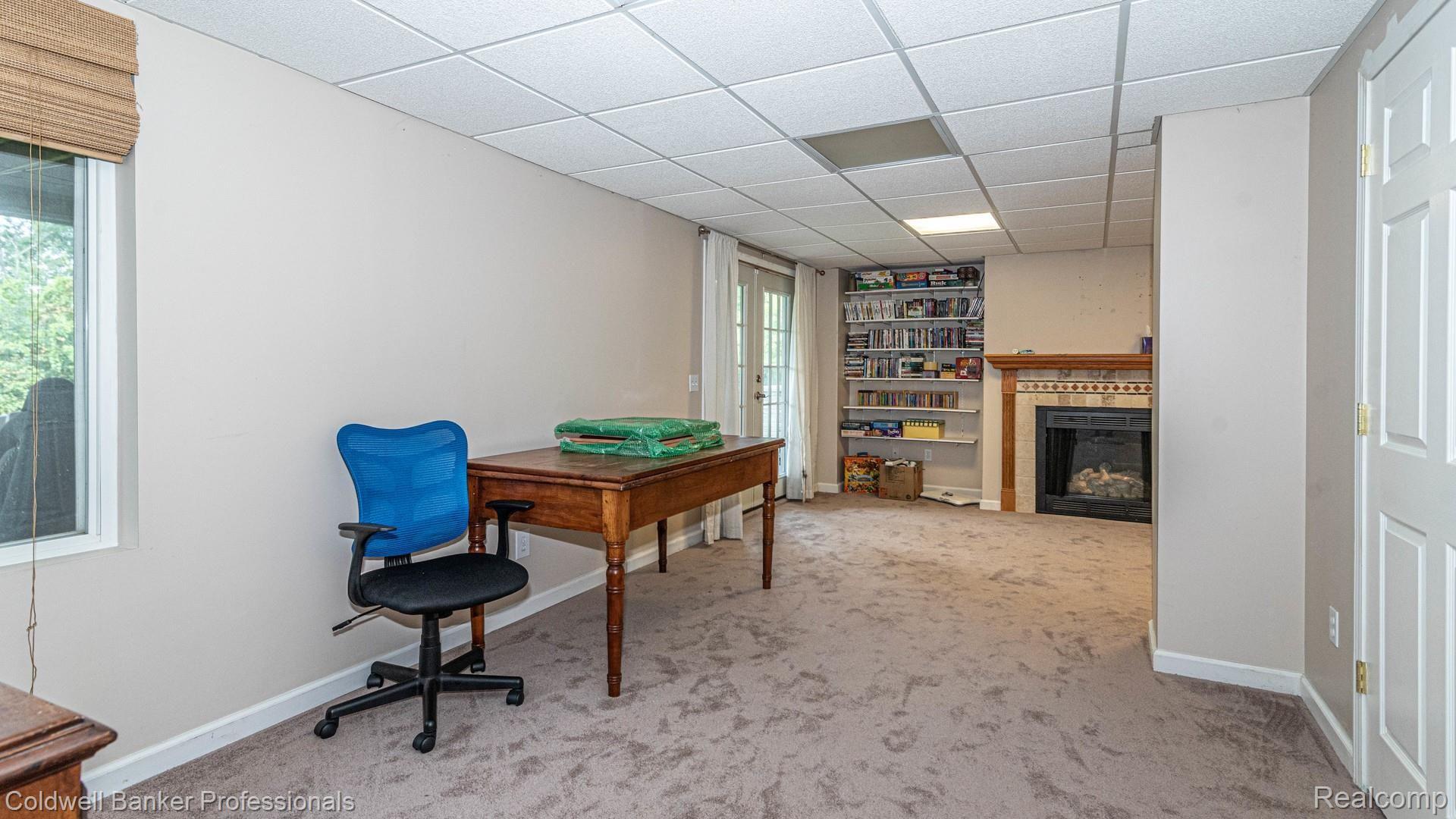 83 Eagle Ridge Road Lake Orion, MI 48360 - Photo 31 of 43 Basement With Built In Bookshelves