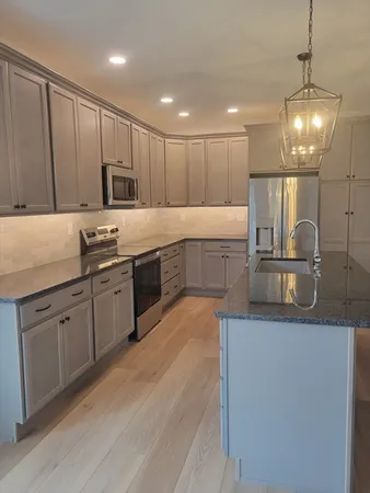 a large kitchen with cabinets