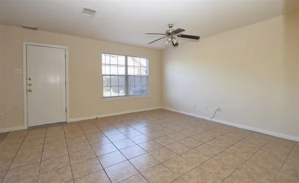 a view of an empty room and window
